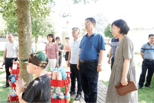 自治区计生协会到葡萄镇中心幼儿园对 向日葵亲子小屋 进行调研